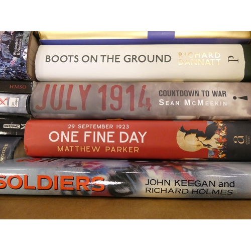 77 - Two cartons of books to include military interest, Scramble for Africa, Boots on the Ground, leather... 