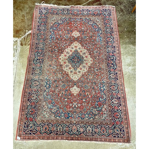 669 - Large patterned rug, approx. 130cm x 200cm