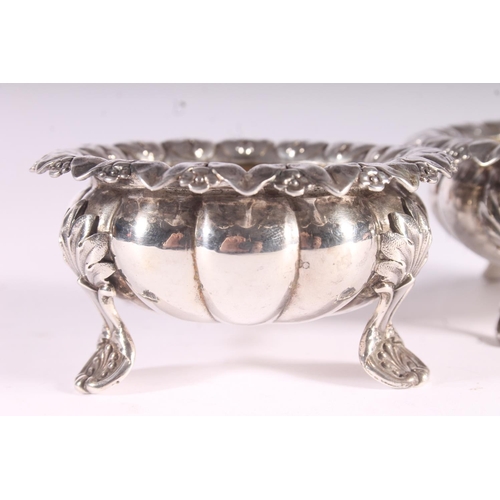 91 - Pair of Geo. IV silver table salts, of cauldron form with cast foliate borders, shaped squat bodies ... 