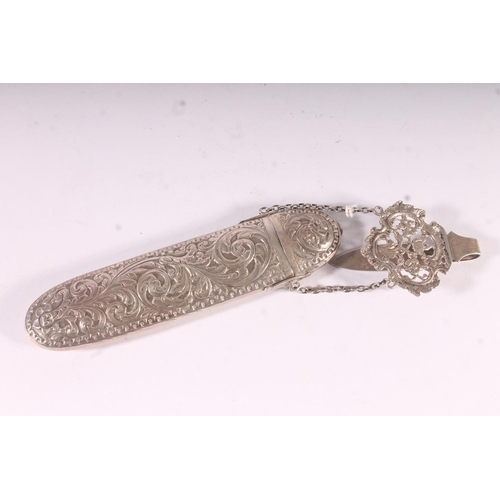 93 - Victorian silver spectacles case, the rococo pierced clip chained to the scrolling acanthus embossed... 