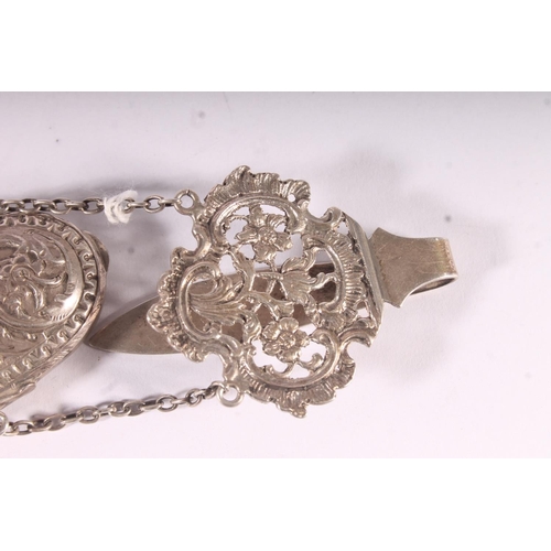 93 - Victorian silver spectacles case, the rococo pierced clip chained to the scrolling acanthus embossed... 