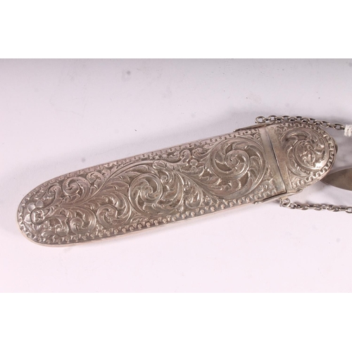 93 - Victorian silver spectacles case, the rococo pierced clip chained to the scrolling acanthus embossed... 