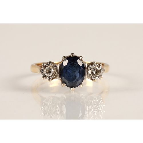 217 - 18ct gold ring set with a central blue gemstone flanked by two diamonds in illusion settings, ring s... 