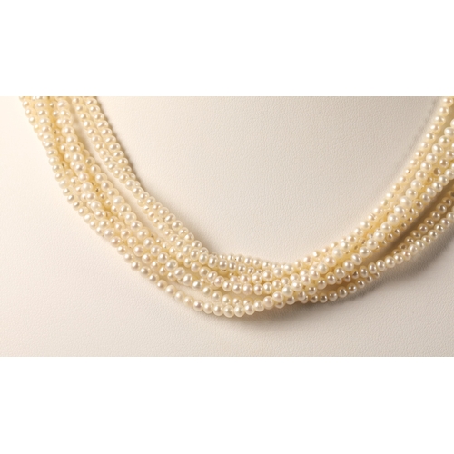 70 - Multi-strand pearl necklace on yellow metal clasp marked 18k