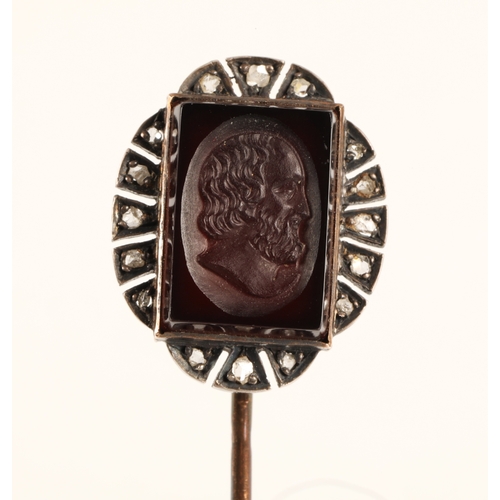 207 - Indistinctly marked yellow metal pin set with a black gemstone intaglio carved profile of a man, sur... 