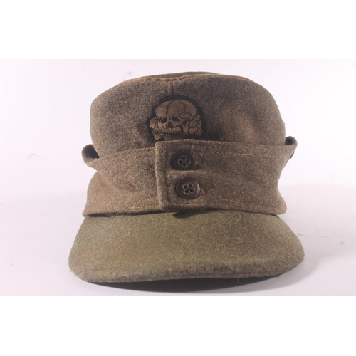 1785 - German WWII style Heer (army) field cap with SS Totenkopf skull badge and eagle cloth badge to side,... 