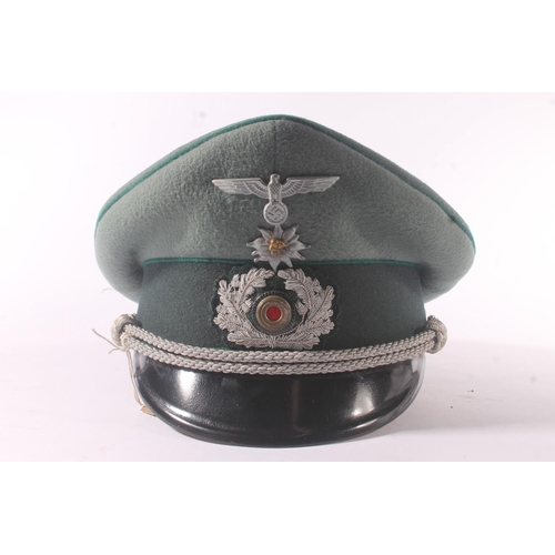 1786 - German WWII style medical officer's visor cap, having eagle and swastika badge, the silk interior em... 
