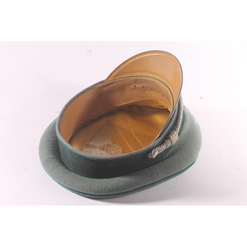 1786 - German WWII style medical officer's visor cap, having eagle and swastika badge, the silk interior em... 