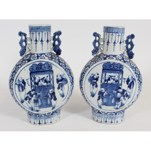 466 - Pair of Chinese blue and white porcelain moon flasks, late Qing period, with reticulated cloud handl... 