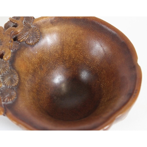 469 - Chinese Rhinoceros Horn libation cup, mid to late Qing period, the handle formed as a trunk extendin... 