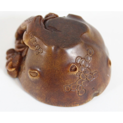 469 - Chinese Rhinoceros Horn libation cup, mid to late Qing period, the handle formed as a trunk extendin... 