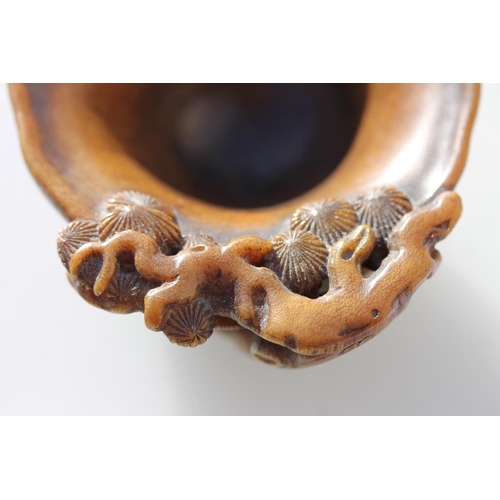 469 - Chinese Rhinoceros Horn libation cup, mid to late Qing period, the handle formed as a trunk extendin... 