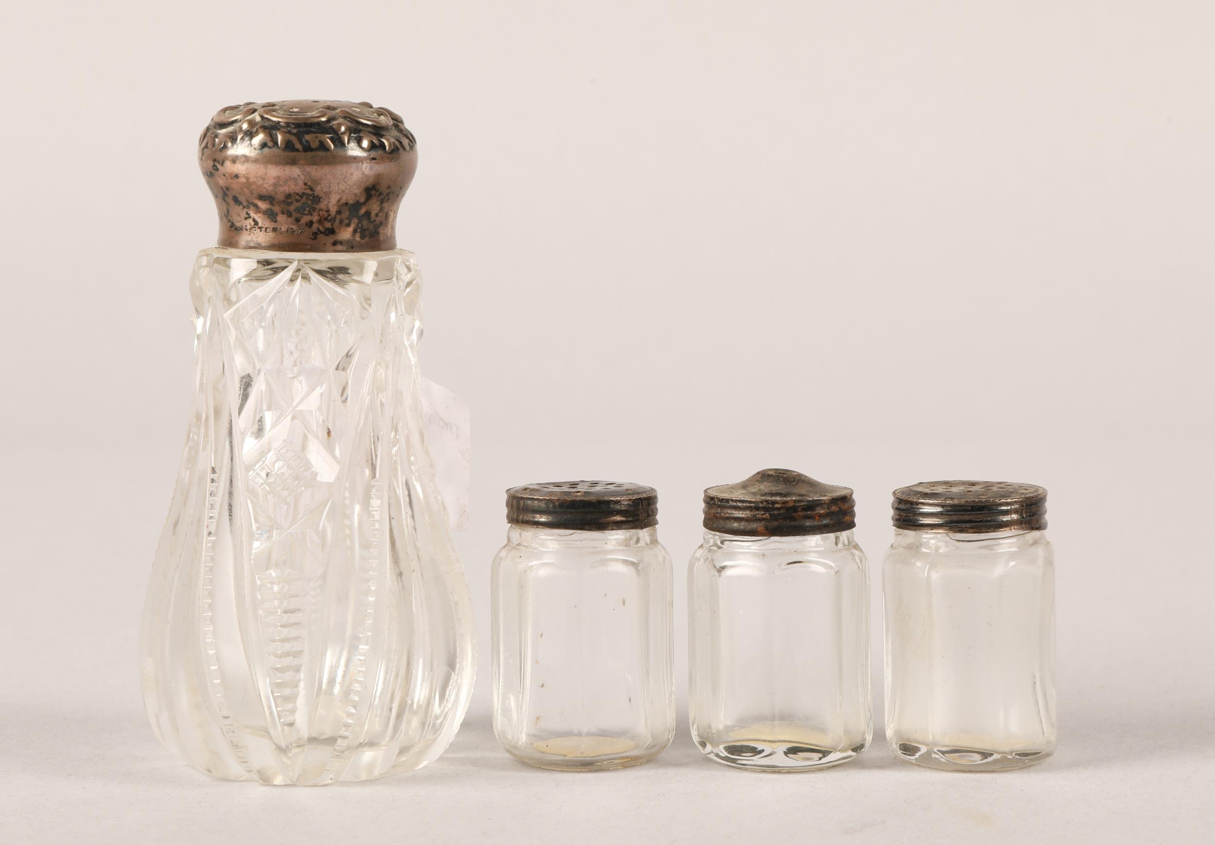 Cut glass salt shaker and three miniature salts all with silver tops (4)