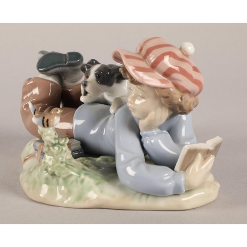 12 - Lladro figurine, boy reading with dog and bird