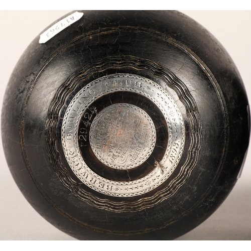43 - Pair of lawn bowls inset with white metal, inscribed Berwick Bowling Club Handicap Prize 1893