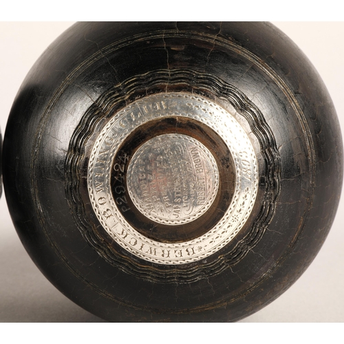 43 - Pair of lawn bowls inset with white metal, inscribed Berwick Bowling Club Handicap Prize 1893