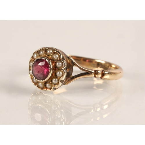 58 - 9ct gold ring set with a pink gemstone surrounded with seed pearls, ring size L/M, 2.2g