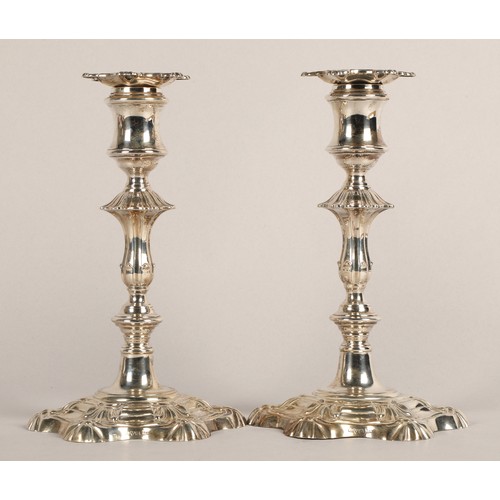 98 - Pair of weighted silver candlesticks, assay marked Chester 1906, maker Walker & Hall22.5cm high... 
