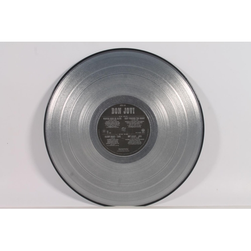54 - Bon Jovi, Wanted Dead Or Alive Collectors' Edition 12'' silver vinyl.