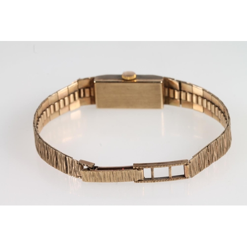 189 - 9ct yellow gold Smiths Empress ladies wristwatch on textured 9ct gold strap, the face with baton mar... 