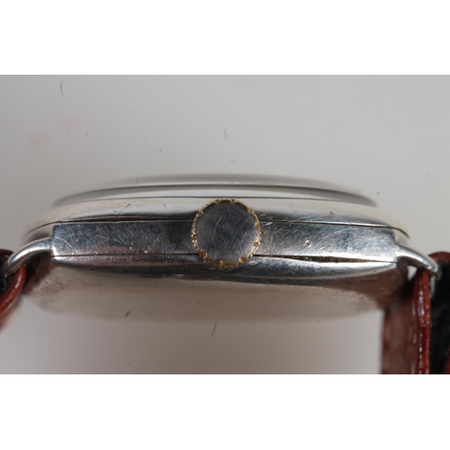 191 - 1930's silver cased gents Omega wristwatch, the champagne dial with arabic numeral chapter ring and ... 