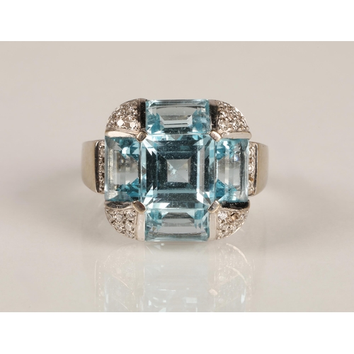 62 - Ladies 18ct white gold topaz ring, central stone surrounded by four rectangular stone interspersed w... 