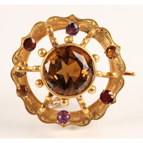 74 - Victorian gold circular brooch set with central cairngorm stone surrounded by six smaller gemstones,... 