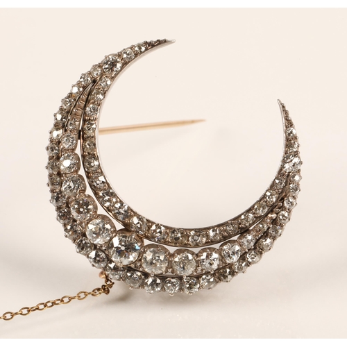 75 - Diamond crescent brooch set with three rows of graduated old cut diamonds set in silver and gold, gr... 