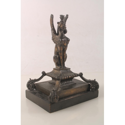 10 - Bronzed metal model of a griffin raised on plinth, 18cm high.