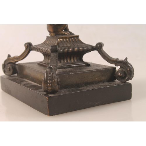 10 - Bronzed metal model of a griffin raised on plinth, 18cm high.