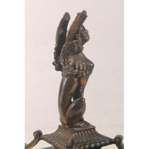 10 - Bronzed metal model of a griffin raised on plinth, 18cm high.