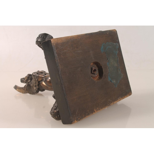 10 - Bronzed metal model of a griffin raised on plinth, 18cm high.