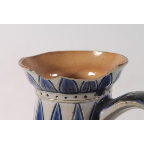 15 - Doulton Lambeth stoneware jug decorated with horses by Florence Barlow, the base stamped FEB, 24cm h... 