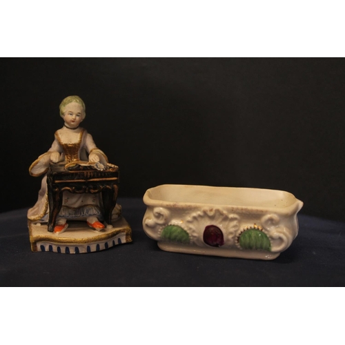 16 - 19th century porcelain figure modelled as a gentleman sat on tree trunk with gun and dog by his side... 