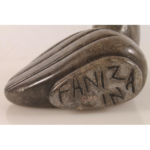 21 - Zimbabwean carved serpentine model of a bird signed to base FAINZNA, 18cm high.