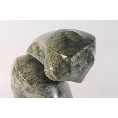 22 - Zimbabwean carved serpentine abstract figure signed to base Moses Masya, 35cm high.