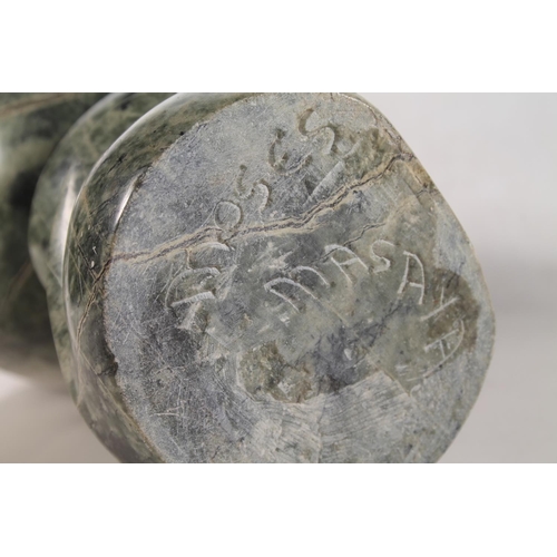 22 - Zimbabwean carved serpentine abstract figure signed to base Moses Masya, 35cm high.