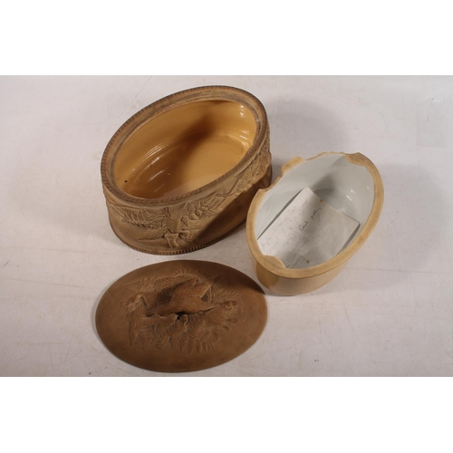 32 - Antique pottery game tureen with insert, 26cm long.