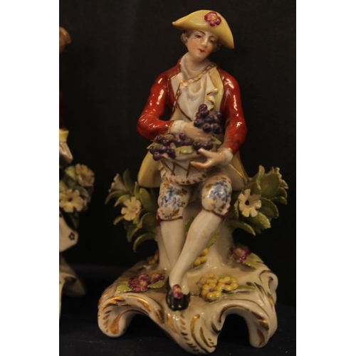 33 - Pair of porcelain figures modelled as man with grapes and lady with flowers, Chelsea style gold anch... 