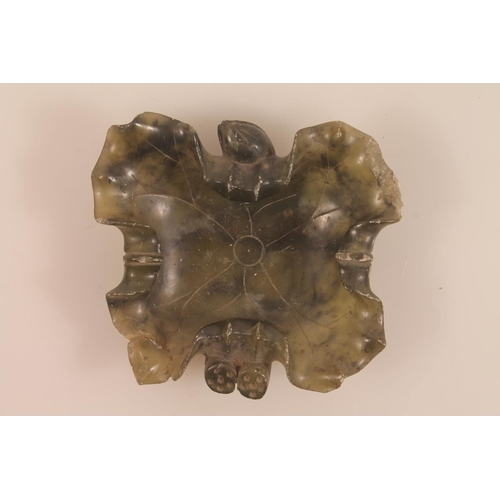 40 - Chinese carved green soapstone lily pad dish, 11cm high and a carved green hardstone fruit.