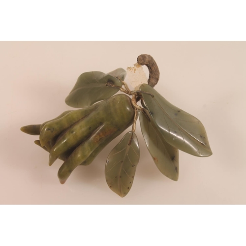 40 - Chinese carved green soapstone lily pad dish, 11cm high and a carved green hardstone fruit.