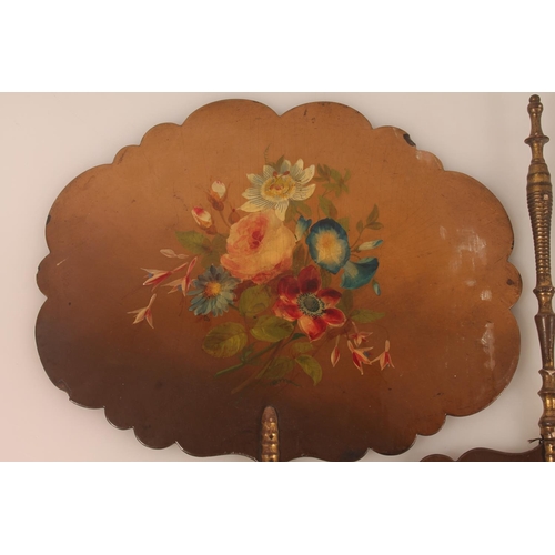 48 - Pair of lacquered hand screens with painted floral vignettes, 42cm long.