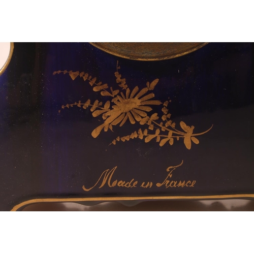 51 - French porcelain mantel clock with hand-painted classical scene, signed Petit, the dial with garland... 