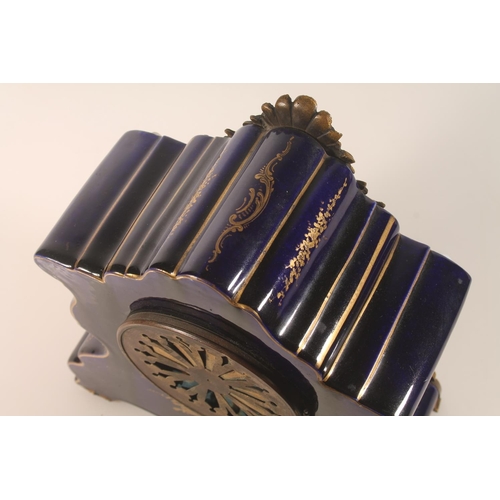 51 - French porcelain mantel clock with hand-painted classical scene, signed Petit, the dial with garland... 