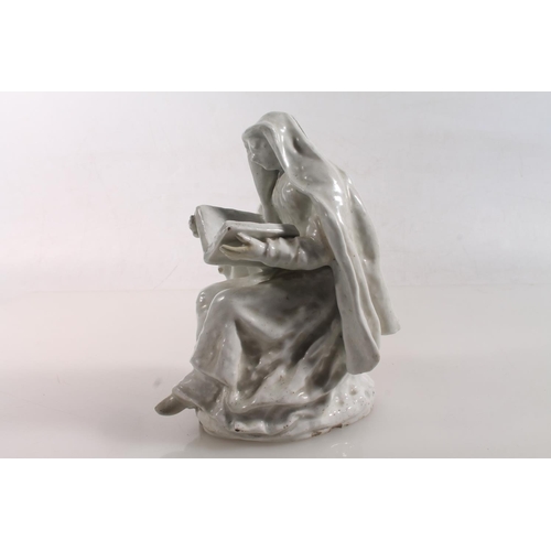 55 - Bow circa 1750/1760 blanc-de-chine porcelain figure of a nun reading a book, 15.5cm high.