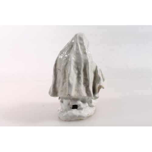 55 - Bow circa 1750/1760 blanc-de-chine porcelain figure of a nun reading a book, 15.5cm high.