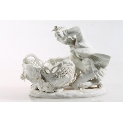 56 - Antique porcelain basket modelled with figure clutching flower support, Meissen style blue crossed s... 