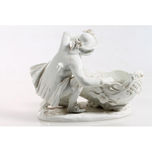 56 - Antique porcelain basket modelled with figure clutching flower support, Meissen style blue crossed s... 