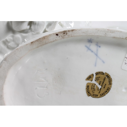 56 - Antique porcelain basket modelled with figure clutching flower support, Meissen style blue crossed s... 