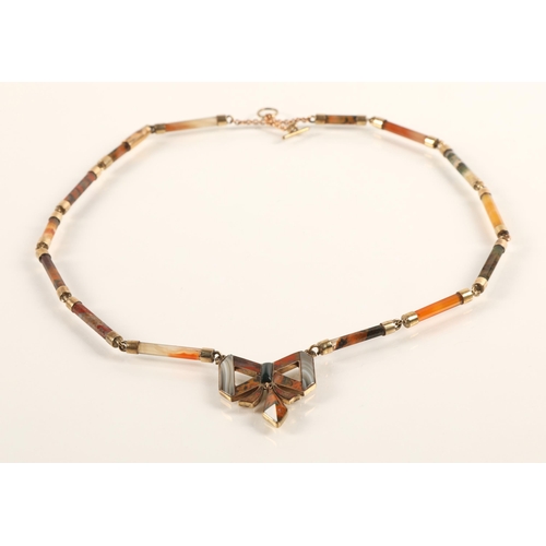 56 - Ladies agate necklace mounted in unmarked yellow metal, 39cm long